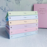 کلاسور 20 حلقه کیوت پالت همراه با صد برگ کاغذ خط دار سفید