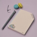 دفترچه فانتزی A6 اسمارتیز فنر از گوشه طرح کتاب